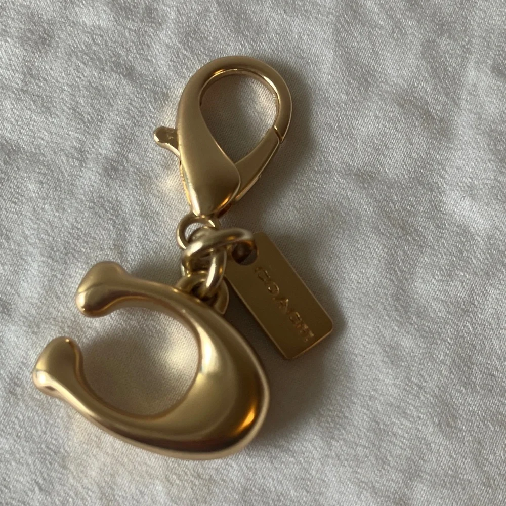 Coach: Metallic Gold Tone Key Holder Charm